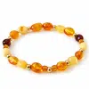Bracelet extensible en ambre naturel de la mer Baltique et perles dorées
