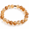 Bracelet extensible en citrine naturelle et perles dorées