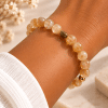 Bracelet extensible en citrine naturelle et perles dorées